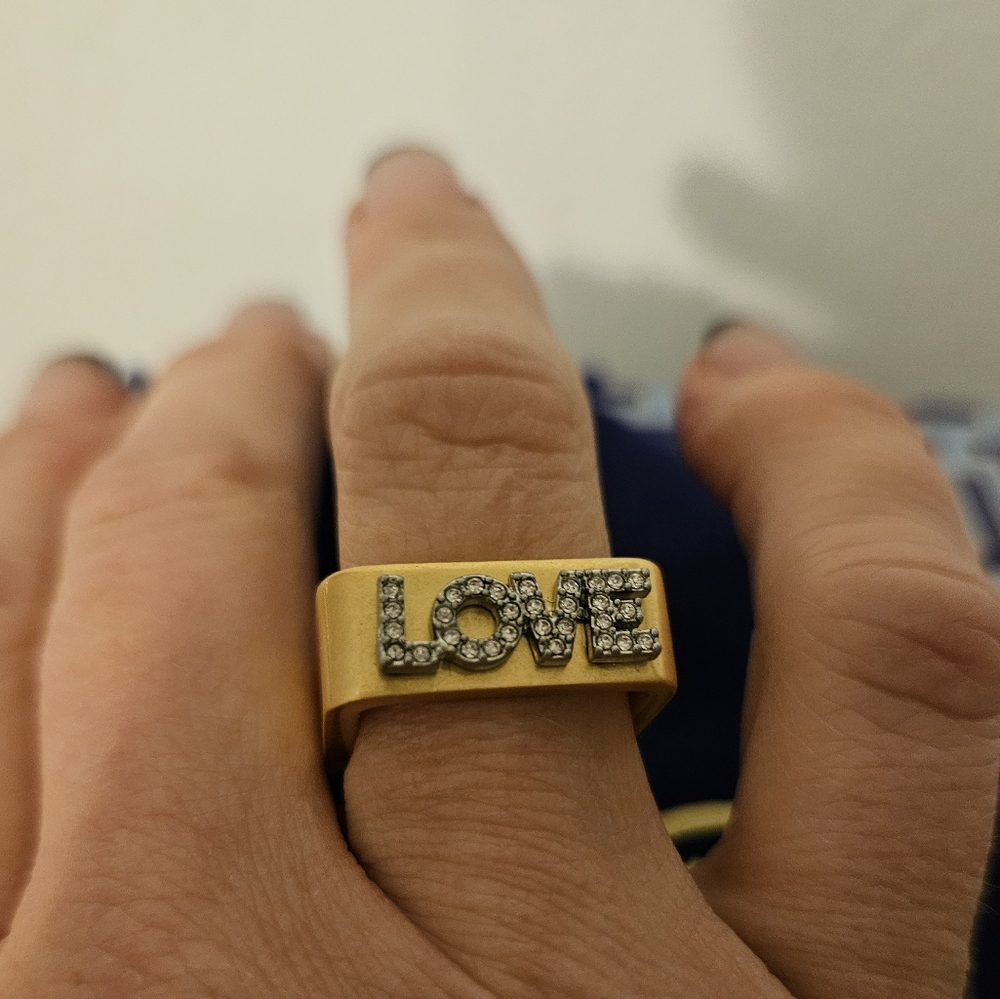 Gold and crystal embedded LOVE ring